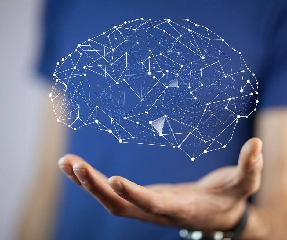 An abstract brain design floats above an outstretched hand.