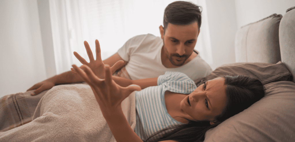 Couple arguing lying on top of the bed early morning